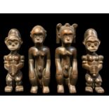 FOUR SMALL FANG FIGURES, carved as reliquary guardians, 24cm h (4)