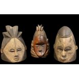 THREE MENDE HELMET MASKS, 27cm h (3)