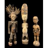 THREE NIGERIAN STANDING FIGURES, including Eket and Igbo examples, tallest 89cm (3)