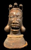LARGE CAMEROON METAL ALLOY KOM MASK, on woven base, 73cm H