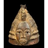 WEST AFRICAN CONICAL CREST MASK, with animal hair and shell fetish bundle, 27cm h