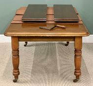 VICTORIAN MAHOGANY ROUNDED END WIND-OUT DINING TABLE - on turned supports and brown pot castors,