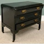 CHEST OF DRAWERS - 20th Century ebonized, three drawer example with swing brass handles, on castors,