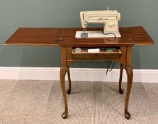 SINGER SEWING MACHINE - in a reproduction mahogany work table/cabinet, on cabriole supports, 79cms