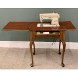 SINGER SEWING MACHINE - in a reproduction mahogany work table/cabinet, on cabriole supports, 79cms