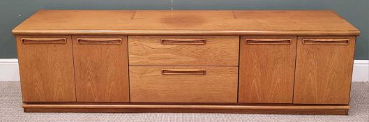 MID-CENTURY TEAK SIDEBOARD - with four cupboard doors flanking two central drawers, 56cms H,