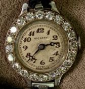 VICKERY PLATINUM CASED LADY'S WRISTWATCH - with diamond set bezel, the named dial with Arabic