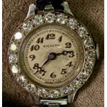 VICKERY PLATINUM CASED LADY'S WRISTWATCH - with diamond set bezel, the named dial with Arabic