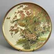 JAPANESE SATSUMA EARTHENWARE CIRCULAR CHARGER - late 19th century, decorated with two central