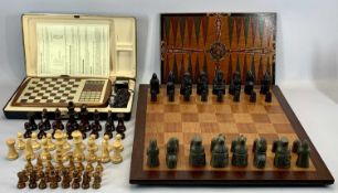 INLAID WOODEN CHESS BOARD, 54.5cms sq, two wooden chess sets, a composite medieval style chess