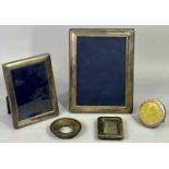 SILVER HALLMARKED PHOTOGRAPH FRAMES (5) - to include three with easel stand backs, 21 x 15.75cms, 16