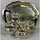 4 PIECE EPNS TEA & COFFEE SERVICE - on a shaped border tray, near matching, 30cms across the teapot,