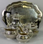 4 PIECE EPNS TEA & COFFEE SERVICE - on a shaped border tray, near matching, 30cms across the teapot,