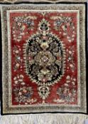 PERSIAN SILK PRAYER RUG - red and black ground with central motif, having floral border, 80 x