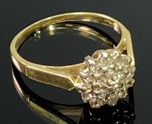 18CT GOLD DIAMOND CLUSTER RING - having 19 small stones claw set to a basket mount, London 1980 date