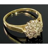 18CT GOLD DIAMOND CLUSTER RING - having 19 small stones claw set to a basket mount, London 1980 date