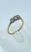 18CT GOLD THREE STONE DIAMOND RING, the three stones totalling 0.5cts overall approx., ring size