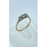 18CT GOLD THREE STONE DIAMOND RING, the three stones totalling 0.5cts overall approx., ring size