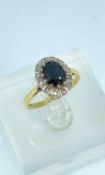 18CT GOLD SAPPHIRE & DIAMOND CLUSTER RING, ring size M, 3.7gms, in ring box Provenance: private