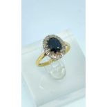 18CT GOLD SAPPHIRE & DIAMOND CLUSTER RING, ring size M, 3.7gms, in ring box Provenance: private