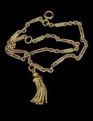 YELLOW METAL TROMBONE & THREE LINK CHAIN with tassel terminal, 21.9gms Provenance: private