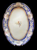 NANTGARW PORCELAIN OVAL DISH of lobed form, blue ground floral border containing series of six