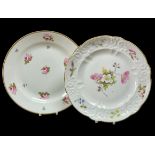 TWO SWANSEA PORCELAIN PLATES being a typically moulded example with flower decoration by Pollard,