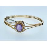 15CT GOLD AMETHYST & SEED PEARL HINGED BANGLE, 14.5gms Provenance: private collection Pembrokeshire,