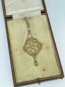 EDWARDIAN 15CT GOLD PERIDOT & SEED PEARL PENDANT, on 9ct gold chain in fitted box marked 'A & N.C.S.