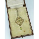 EDWARDIAN 15CT GOLD PERIDOT & SEED PEARL PENDANT, on 9ct gold chain in fitted box marked 'A & N.C.S.