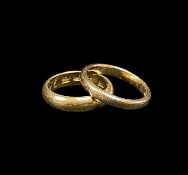 TWO YELLOW GOLD WEDDING BANDS, one stamped '14K' (3.3gms), the other '20K' (5.6gms), both engraved