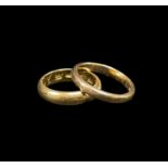 TWO YELLOW GOLD WEDDING BANDS, one stamped '14K' (3.3gms), the other '20K' (5.6gms), both engraved