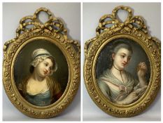 19TH CENTURY OVAL PORTRAITS, a pair - reverse painting on convex glass depicting two pensive young