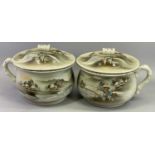 JAPANESE PORCELAIN CHAMBER POTS, A PAIR - painted with figures, building and landscapes and with