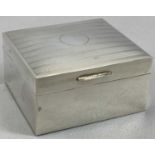 HALLMARKED SILVER CIGARETTE BOX - London 1925, the hinged cover with machine engraved decoration,