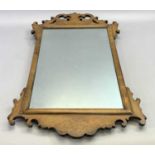 A GEORGIAN STYLE WALNUT FRAMED & FRETWORK WALL MIRROR - 68 x 38cms