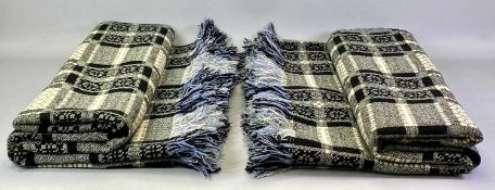 WELSH WOOLLEN BLANKETS, A NEAR PAIR - fringed, double sided green/black/cream/blue geometric pattern