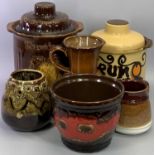 A GERMAN RUMTOPF STORAGE JAR - brown glazed and moulded with fruit, with cover, 30cms H, a similar