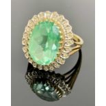 BROOKS & BENTLEY 9CT GOLD DRESS RING - having a central 15 x 10mm facet cut oval, possibly topaz,