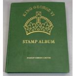 STAMPS - George VI Crown Album containing a well filled collection of mint stamps, many top values