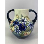 MOORCROFT VASE - of pear shape two handled form, tube lined in the 'Spring Flowers' pattern, on a