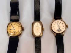 9CT GOLD CASED LADY'S WRISTWATCHES (3) - all having black leather straps to include a Bulova