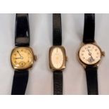 9CT GOLD CASED LADY'S WRISTWATCHES (3) - all having black leather straps to include a Bulova