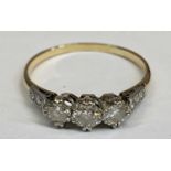 AN UNMARKED, BELIEVED, GOLD & PLATINUM 9 STONE DIAMOND RING - having a central 0.25ct diamond,