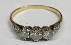 AN UNMARKED, BELIEVED, GOLD & PLATINUM 9 STONE DIAMOND RING - having a central 0.25ct diamond,