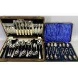 CASED CUTLERY - two sets to include a stylish set of 12 teaspoons with matching sugar tongs and an