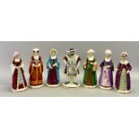 PORCELAIN FIGURINES (7) - King Henry VIII and his six wives, all marked 'H T' to the underside,