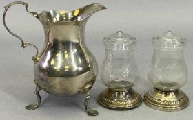 SMALL TABLE SILVER - 3 items to include a scroll handle, three footed cream jug, London 1936,