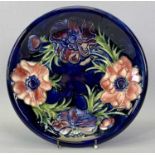 MOORECROFT 'ANEMONE' CIRCULAR SHALLOW DISH - blue ground with impressed marks, signed and with Queen