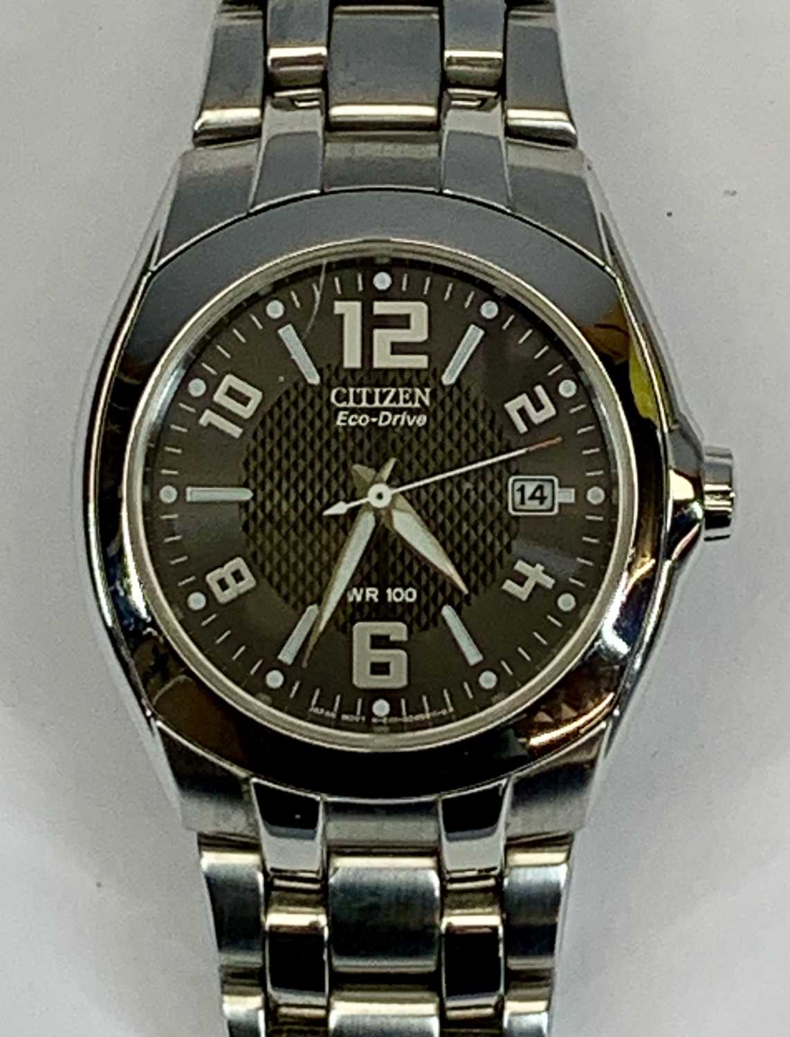 CITIZEN ECODRIVE WR100 WRISTWATCH - 38mm stainless steel case, black dial with Arabic and baton hour